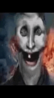 a close up of a person 's face with a smiley face and a tooth missing .