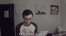 a man with glasses says oh that 's it in a room