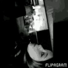 a black and white photo of a woman with flipagram written in the corner
