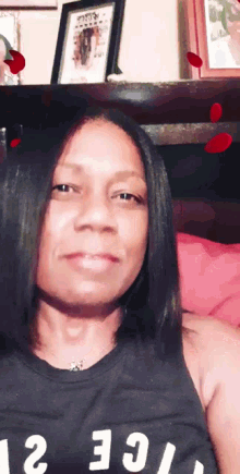 a woman is wearing a black tank top that says ice 2