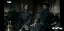a man and a boy are sitting next to each other and the man says praise be on to you .