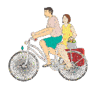 a man and a woman are riding a bicycle with a suitcase on the back