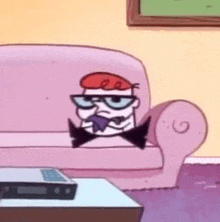 dexter from cartoon network is sitting on a pink couch .