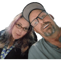 a man and a woman are posing for a picture and the woman has pink hair