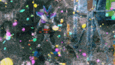a robot is surrounded by a bunch of colorful balloons