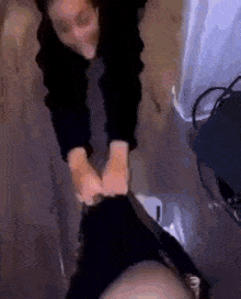 a person is holding another person 's feet in a blurred photo .