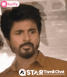 a man with a beard is on a star tamil chat