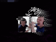 a man wearing headphones talks to another man in a dark room