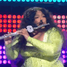 Play Flute Lizzo GIF - Play Flute Lizzo About Damn Time Song GIFs
