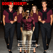a man in a maroon shirt is standing in front of a group of people with the words good night written in red