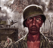 a man wearing a helmet is standing in front of a tank