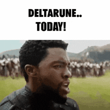 a man with a beard is standing in front of a crowd of people and says `` deltarune today '' .