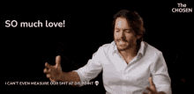 a man in a white shirt says " so much love " in a black background