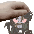 a hand is touching a cartoon character 's face with a towel .
