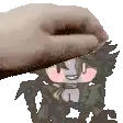 a hand is touching a cartoon character 's face with a towel .