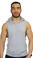 a man with a beard wearing a grey tank top