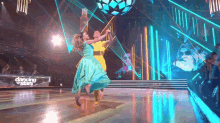 a man and woman are dancing on dancing stars