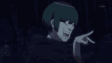 a man with green hair is making a funny face and pointing his finger .