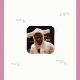 a pixelated image of a man in a suit and tie on a pink background
