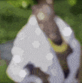 a blurred image of a person 's face with a white shirt on