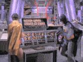 a man in a yellow cape stands in front of a crime computer