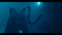 a backpack is floating in the water with a sticker on it that says ' ucsd '