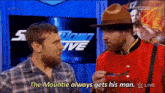 a man in a canadian uniform is talking to another man in a plaid shirt