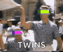 a couple of men standing next to each other with the word twins written on the bottom