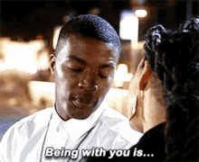 a man is talking to a woman and saying `` being with you is ... ''