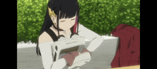 a girl in a white top is holding a white box