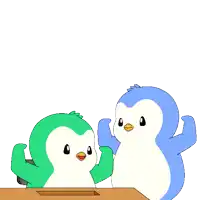 a blue and green penguin are sitting at a desk