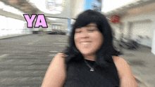 a blurry picture of a woman with ya written in pink letters