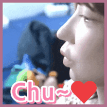 a close up of a person 's face with the word chu in pink letters