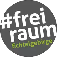 a logo that says #freiraum fichtelgebirge