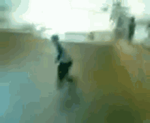 a blurry picture of a person riding a skateboard down a ramp
