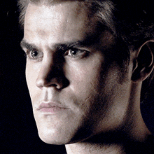 a close up of a man 's face with sweat on his forehead