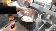 a person is mixing something in a bowl with a knife and the words made in animotica are visible
