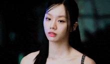 a close up of a woman with long black hair