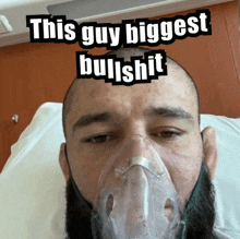 a man in a hospital bed with an oxygen mask on his face