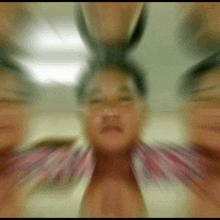 a blurry picture of a man 's face with a bunch of faces around it