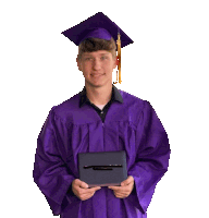 a young man wearing a purple graduation cap and gown holds a diploma