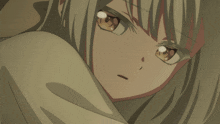 a close up of a girl 's face with a very serious look on her face