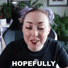 a woman with purple hair is wearing a black shirt that says hopefully on it