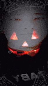 a person with a pumpkin carved into their face is wearing a shirt that says nba