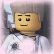 a close up of a lego character with a smile on his face .