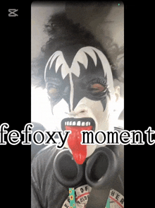 a person with a kiss face painted on their face and the words fefoxy moment below them