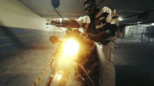 a man is riding a yamaha motorcycle in a dark parking lot