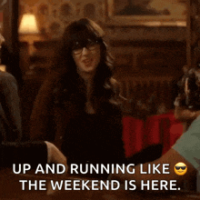a woman is dancing in a bar and says up and running like the weekend is here