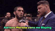 ufc fighter adriano martins is being interviewed by a man in a blue suit