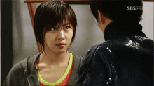 a man and a woman are looking at each other on a screen that says sbs hd on it